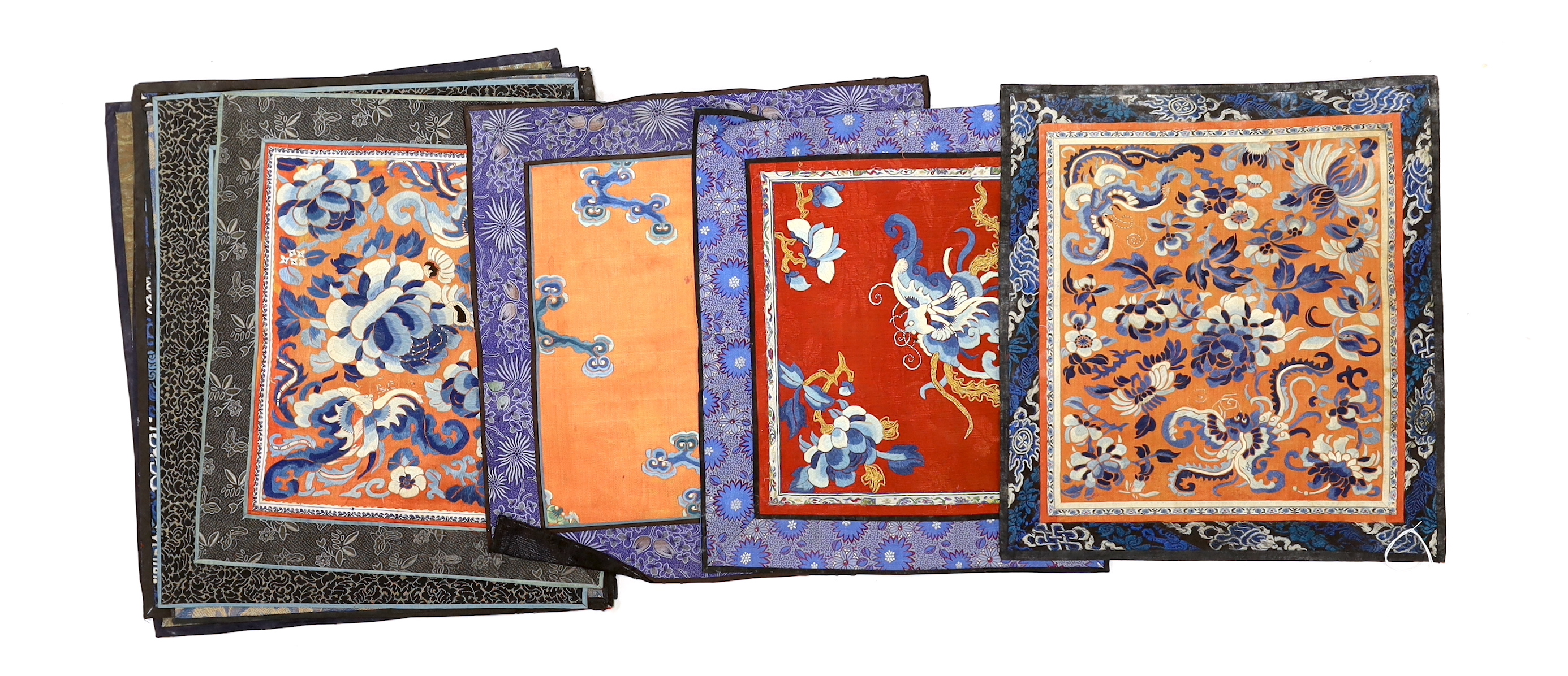 Nine Chinese silk embroidered panels, framed with silk damask borders, circa 20th century, largest 37cm x 41cm